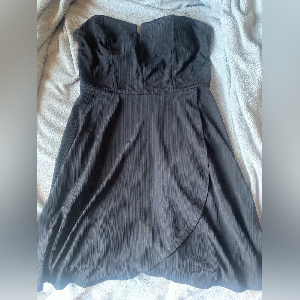 Strapless black dress with a slit. Size large.
